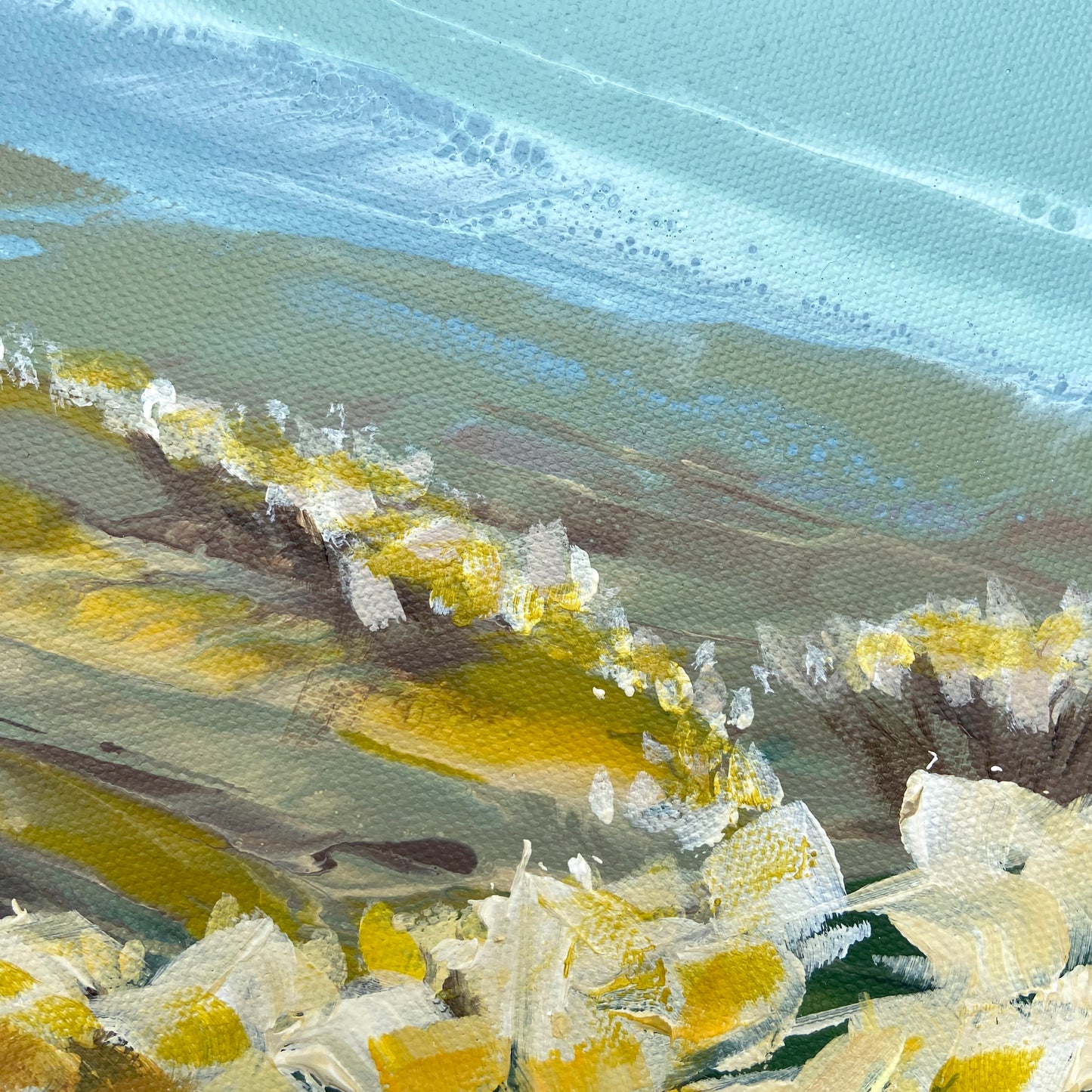 Close-up of a painting with yellow and green hues
