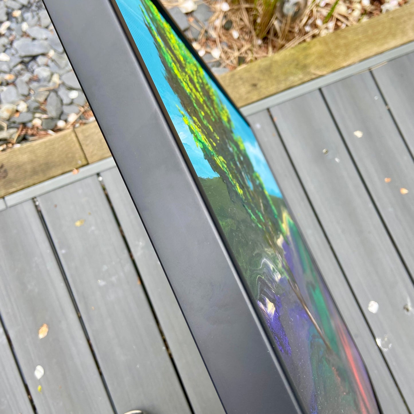 Close-up of side of painting showing thickness of frame