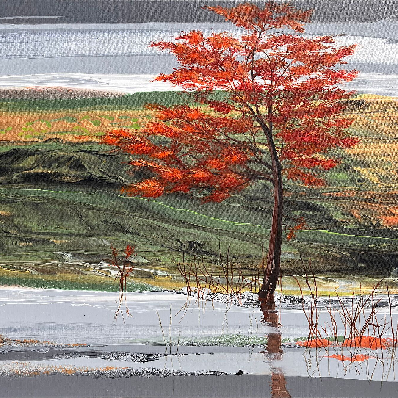 Julie Vatcher Artist presents a radiant tree under a silver sky—reflected in water and framed by delicate reeds, this piece glows with movement and light