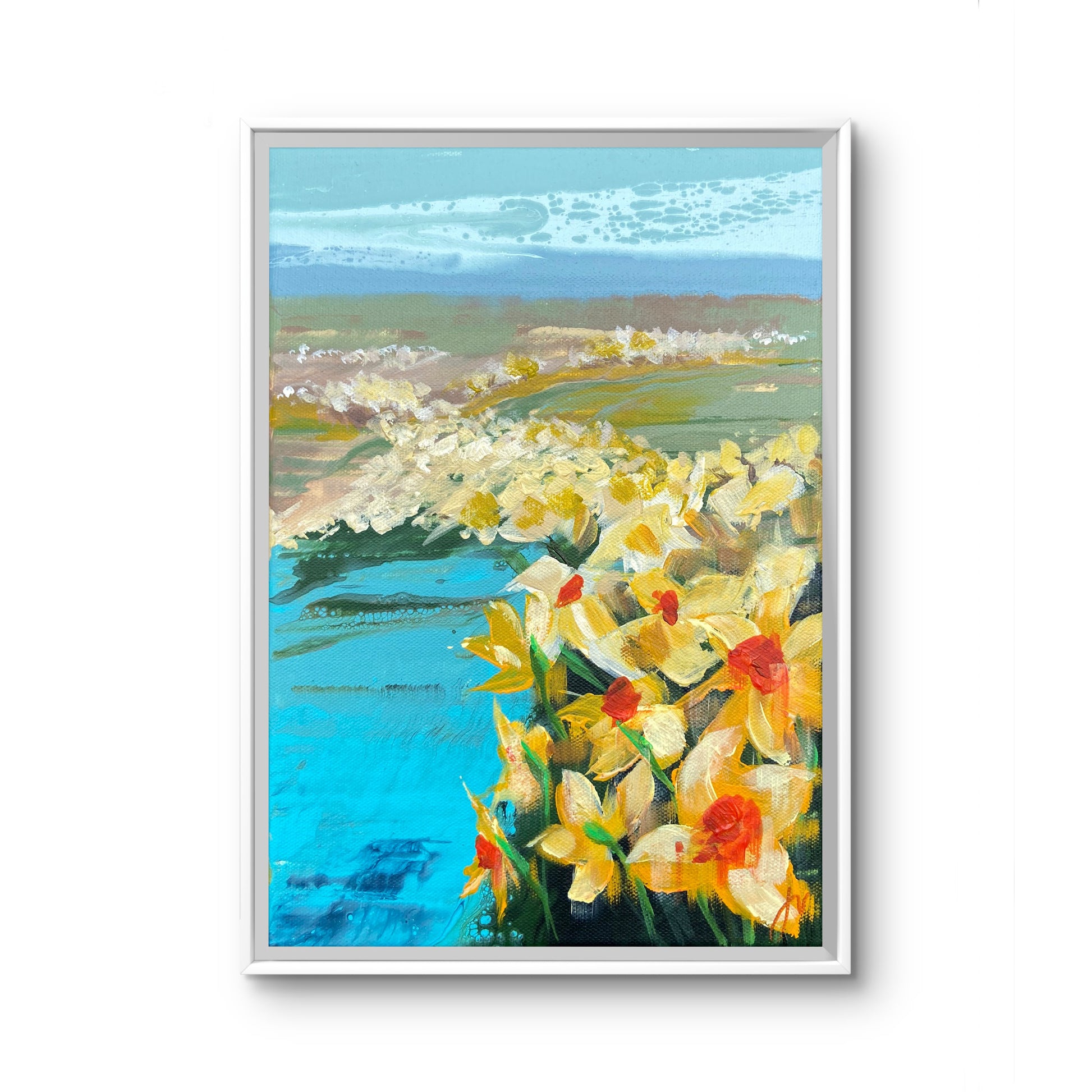 Framed painting of daffodils by a lake with a hills background